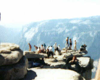 Picture of College Students standing on top edge of Half Dome.